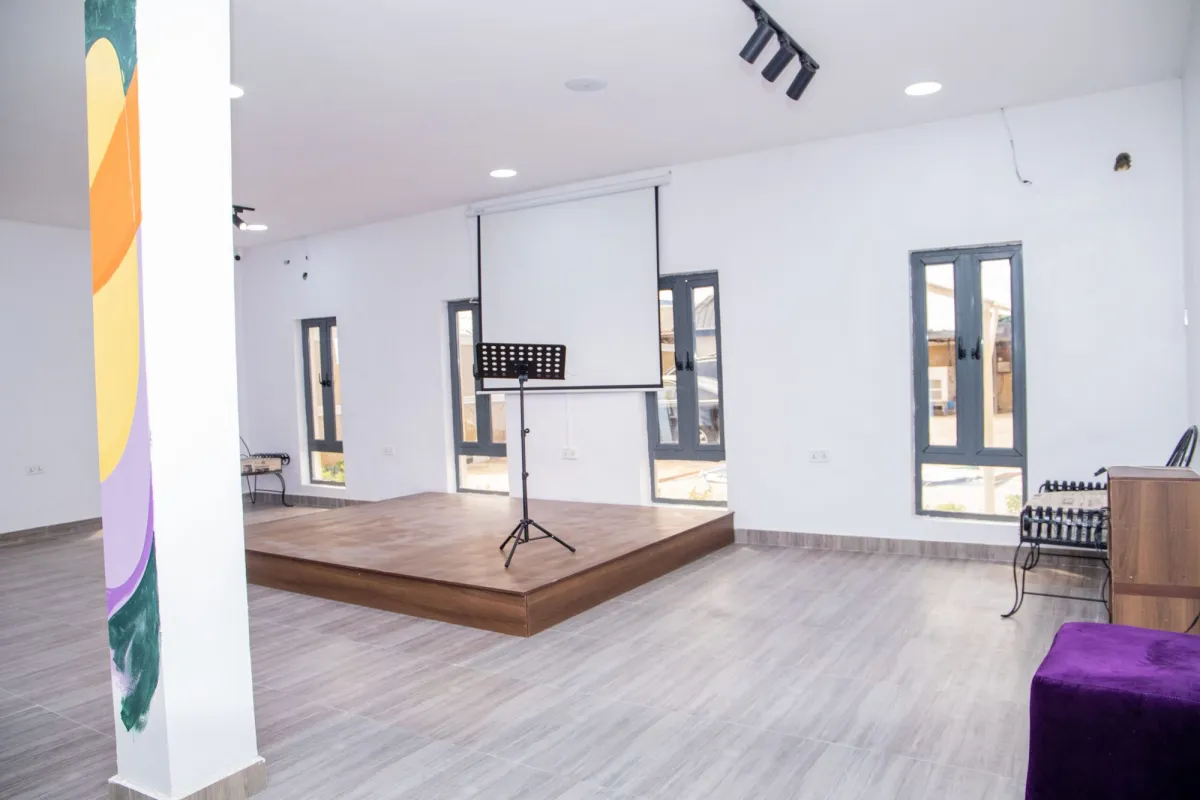 The main hall with a small stage and seating
